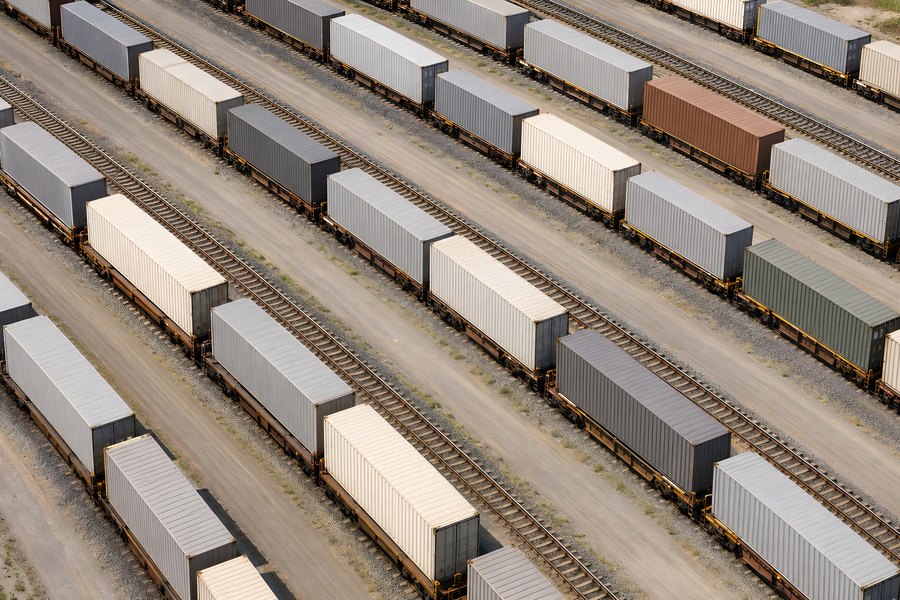 Aerial View of Freight Train Containers on Parallel Railroad Tracks in an Intermodal Rail Yard